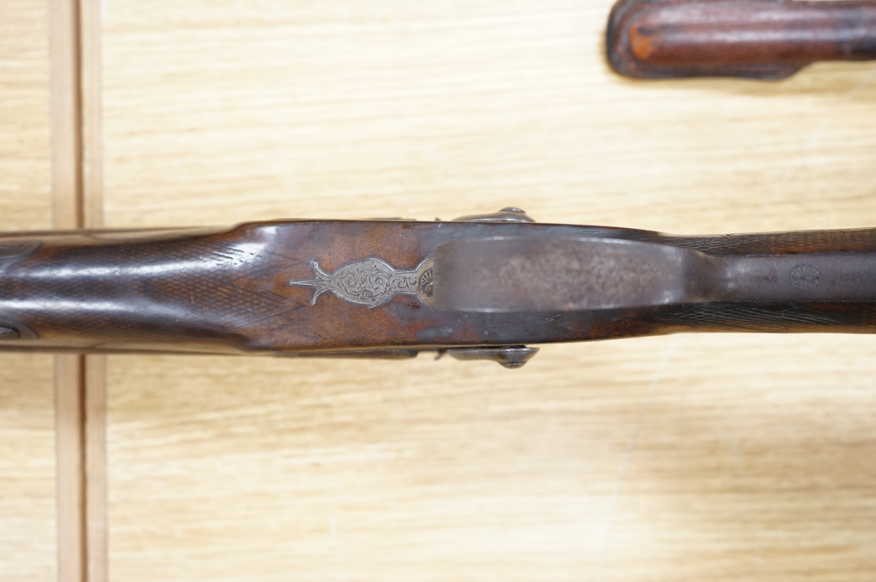 A double barrel 12 bore percussion sporting gun, signed Cocksedge, Hadleigh, with engraved locks and iron furniture, half stocked chequered grip with finger support in wood above guard